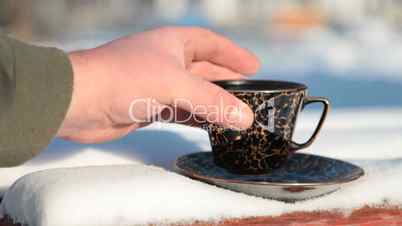 cup of hot coffee in winter