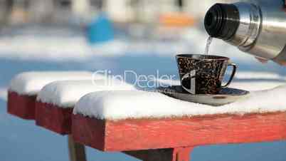 cup of hot coffee in winter