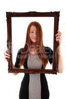 Girl with picture frame.