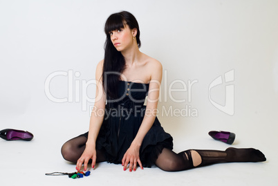 Young woman in torn stockings