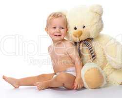 Happy child with big soft bear toy