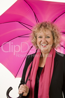 Middle age female portrait with pink umbrella