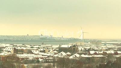 Winter view of City of Liverpool with wind turbines in distance 2
