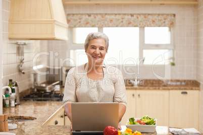 Senior woman working on her laptop