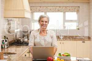 Senior woman working on her laptop