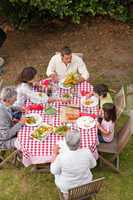 Family eating outside in the garden