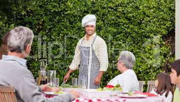 Family eating outside in the garden