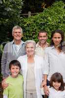 Family looking at the camera in the garden