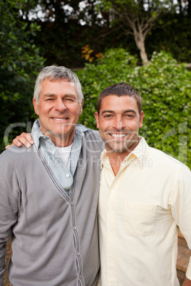 Man with his father looking at the camera