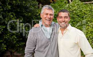 Man with his father looking at the camera