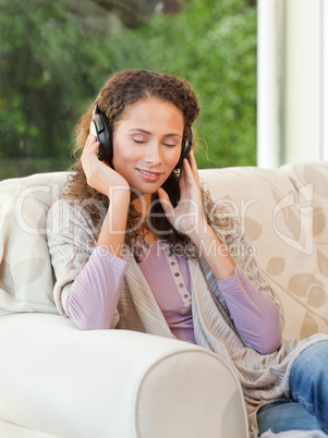 Radiant woman listening to music