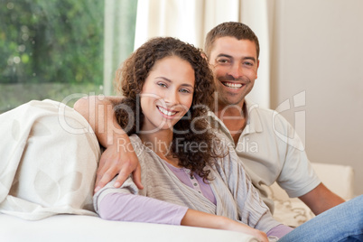 Joyful couple looking at the camera