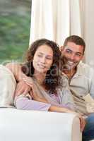 Couple sitting in their sofa