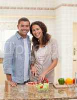 Handsome man cooking with his girlfriend