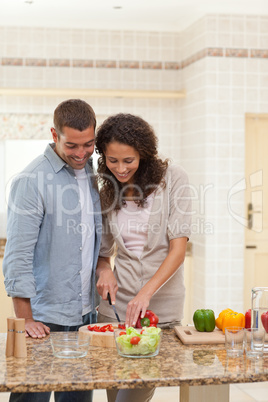 Handsome man cooking with his girlfriend