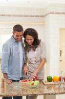 Handsome man cooking with his girlfriend