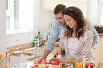 Handsome man cooking with his girlfriend