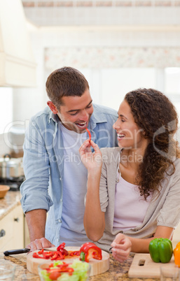 Man eating vegetables with his wife