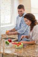 Handsome man cooking with his girlfriend