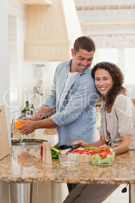 Handsome man cooking with his girlfriend