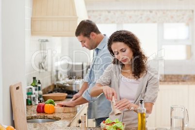 Handsome man cooking with his girlfriend