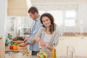 Handsome man cooking with his girlfriend