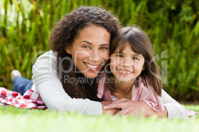 Adorable mother with her daughter in the garden