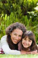 Adorable mother with her daughter in the garden