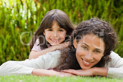 Adorable mother with her daughter in the garden