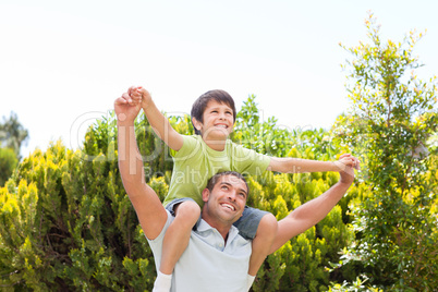 Father with his son playing in the garden