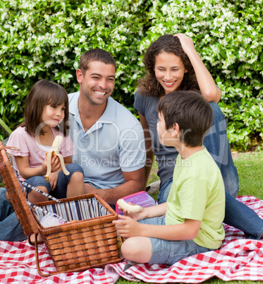 Family picnicking in the garden