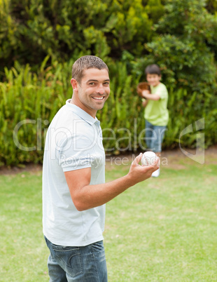 Son playing football with his father