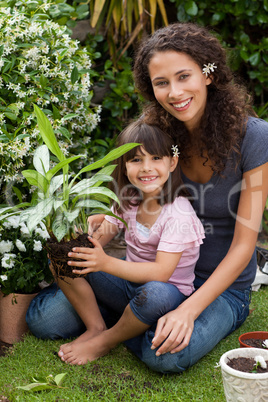 Mother and daughter working in the garden