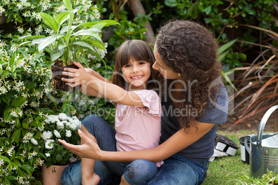 Mother and daughter working in the garden