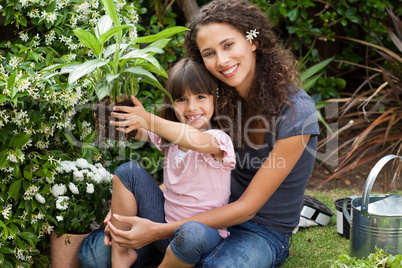 Mother and daughter working in the garden