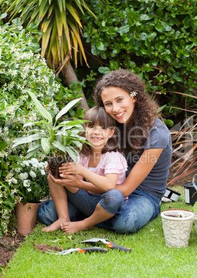 Mother and daughter working in the garden