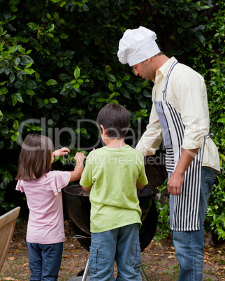 Family  having a barbecue in the garden