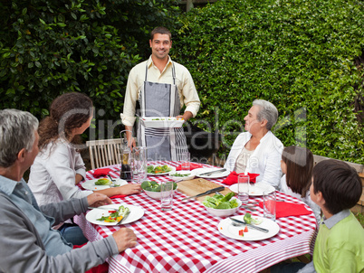 Portrait of a joyful family in the garden