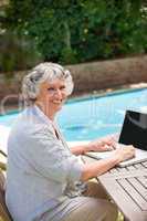 Mature woman working on her laptop