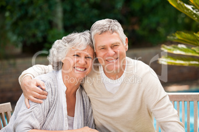 Senior couple hugging in the garden