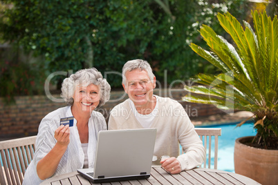 Retired couple buying something on internet