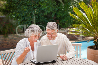 Retired couple buying something on internet