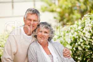 Retired couple looking at the camera