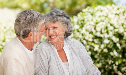 Woman looking at her husband in the garden