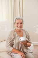 Mature woman drinking some tea