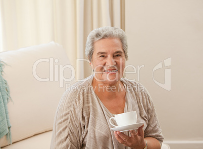 Mature woman drinking some tea