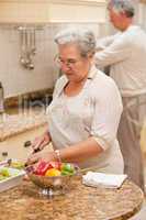 Senior couple cooking in the kitchen