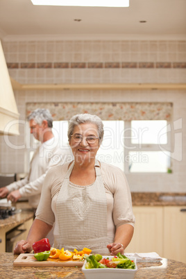 Senior couple cooking in the kitchen