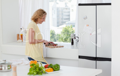 Attractive woman cooking at home