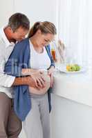 Couple hugging in the kitchen